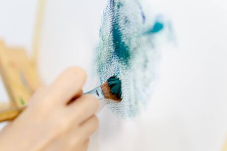 Artist's brush stroke on canvas while painting, closeupの写真素材