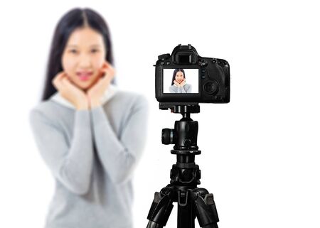 Back of camera with Teenage Asian model posing defocused. Beauty lifestyle vlogger model conceptsの写真素材