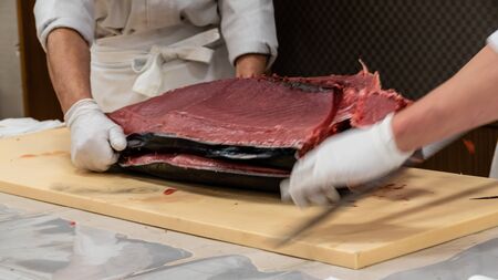 Chef preparing tuna sashimi