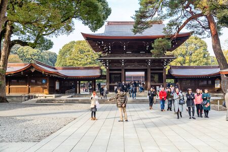 TOKYO, JAPAN - FEBRUARY 7, 2019: Crowds of tourists in Meiji Shrine in Shibuya, Tokyo. The shrine is officially designated Kanpei-taisha, the 1st rank of government supported shrines.のeditorial素材