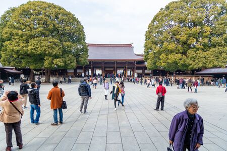 TOKYO, JAPAN - FEBRUARY 7, 2019: Crowds of tourists in Meiji Shrine in Shibuya, Tokyo. The shrine is...