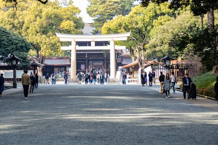TOKYO, JAPAN - FEBRUARY 7, 2019: Crowds of tourists in Meiji Shrine in Shibuya, Tokyo. The shrine is...