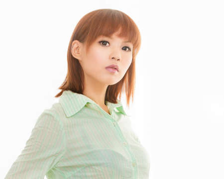 Asian woman with formal business shirt looking seriousの写真素材