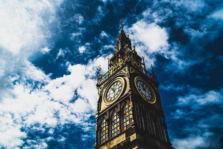 The christchurch clock tower from below, with a blue skyの写真素材