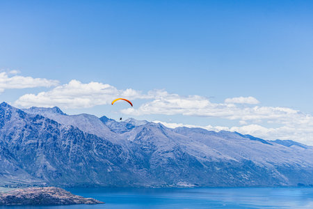A paraglide above the water in Queenstownの写真素材