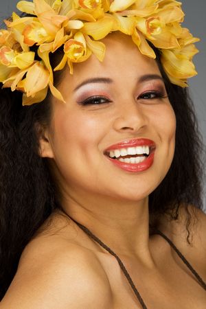 Ethnic young woman in flower head dressの写真素材