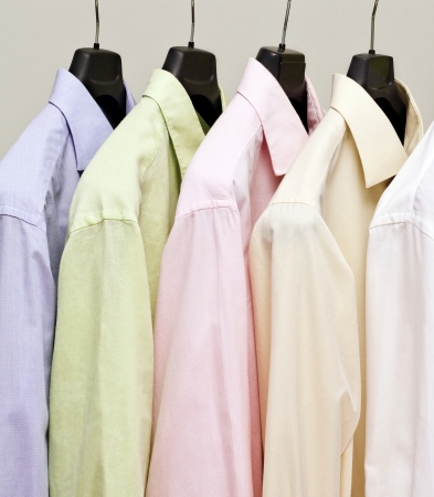 Multicolor men shirts on hanger  Studio shot の写真素材