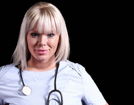 Medical staff smilling with sthetoscope on black backgroundの写真素材