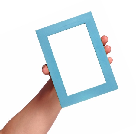 Human hand showing empty photo frame. Studio shot isolated on whiteの写真素材