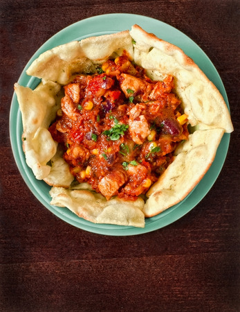 Mexican crock pot chicken in rich sauce with tortillas. Overhead shot の写真素材