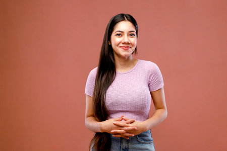 Portrait of a beautiful young asian woman on a pink backgroundの写真素材