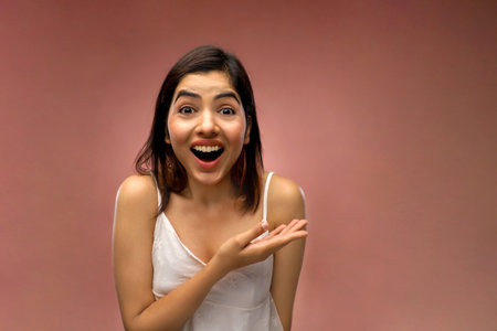 Portrait of young beautiful asian woman laughing and looking at cameraの写真素材