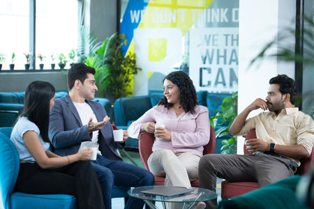 Smiling group of businesspeople having a meeting in a modern office