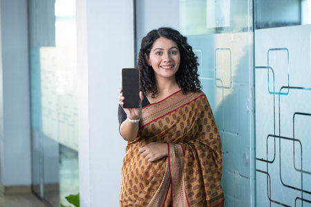 Happy pregnant woman taking selfie with mobile phone