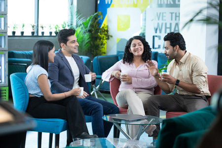 Group of happy young business people discussing business plan  in the officeの写真素材