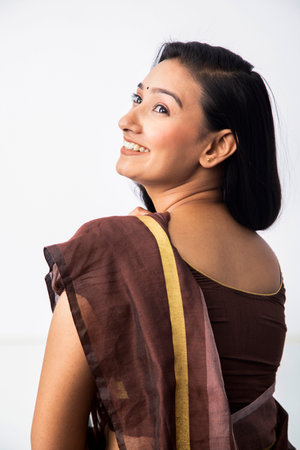 Portrait of a beautiful asian woman smiling and looking away.