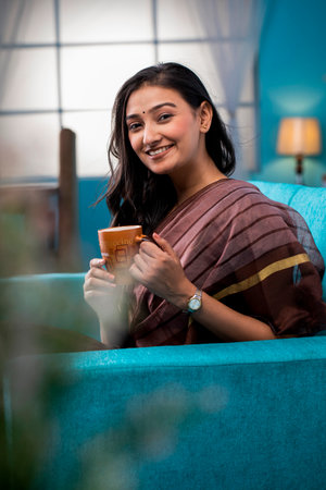 Portrait of a beautiful young woman drinking coffee.