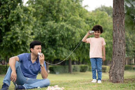 Father and son playing in the park. Concept of happy family.の写真素材