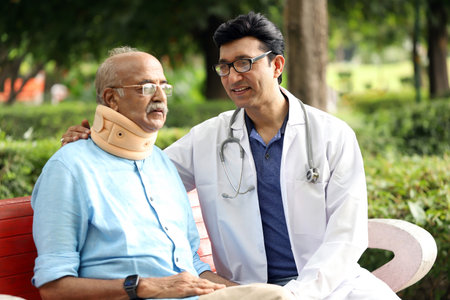 Doctor and senior patient in the park. Healthcare and medical service.の写真素材