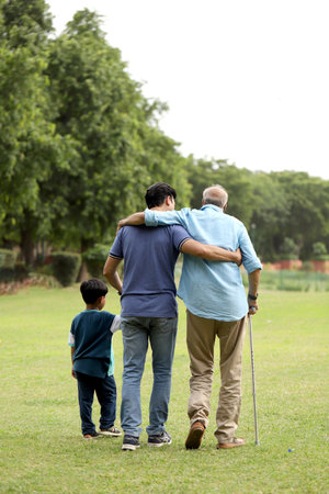 Grandfather and grandson in the park. Asian people.の写真素材