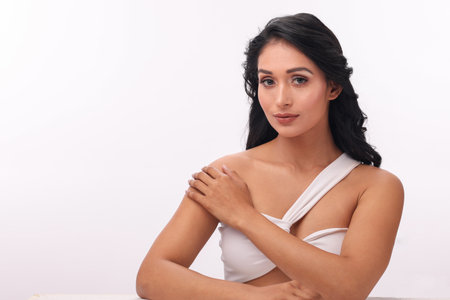 Portrait of a beautiful young woman in lingerie looking at camera.の写真素材