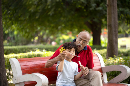 Grandfather and grandson in the park. Selective focus.の写真素材