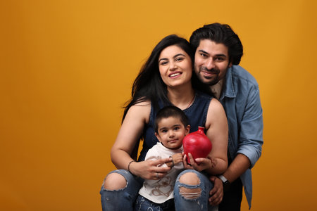 Happy family on yellow background.の写真素材