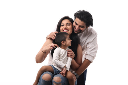 happy young family with little daughter isolated on white background, studio shot