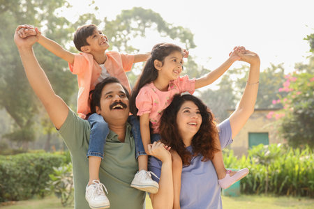 Happy family with children in park on sunny day. Vacation conceptの写真素材