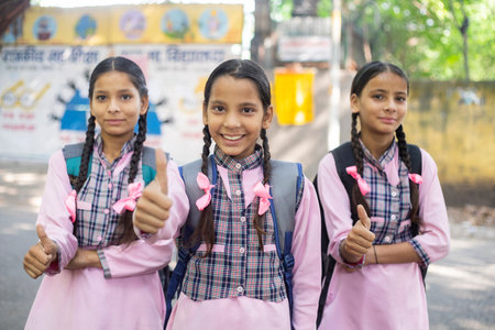 Portrait of smiling schoolgirls at schoolの写真素材