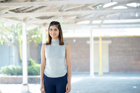 Portrait of a beautiful young woman standing in an urban environment.の写真素材