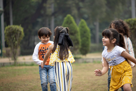 Group of asian children having fun playing together in the park.の写真素材