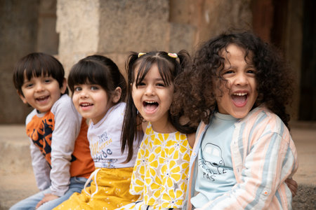Portrait of a happy group of asian children laughing and looking at cameraの写真素材