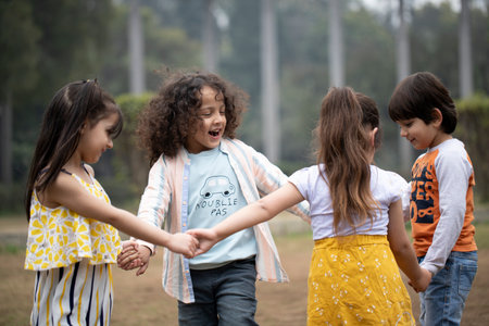 Group of kids playing together in the park. Education and friendship concept.の写真素材