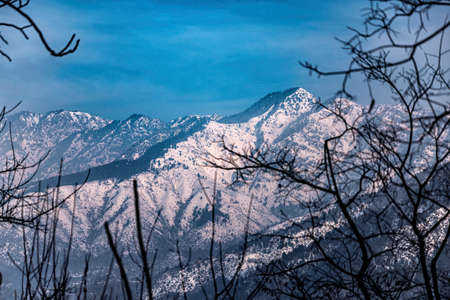 View of the mountain behind Dal Lake which is covered with fresh snowfall, Srinagar, Kashmir, India