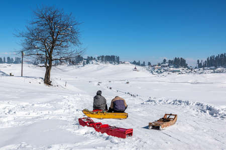 Tourist enjoying sledge, Gulmarg, Kashmir, India
