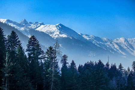 Beautiful view of sonmarg in winter, Snow covered Himalayan Mountains with pine trees and river, Kashmirの写真素材
