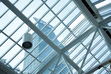 View of a tall building through a glass sealing