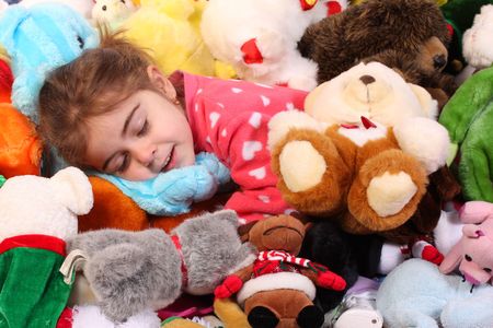  sleeping with her toysの写真素材
