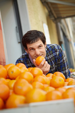 Young person in a fruit stallの写真素材