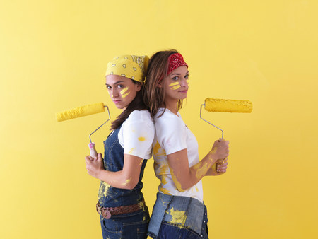 Girls posing in front of wall.の写真素材