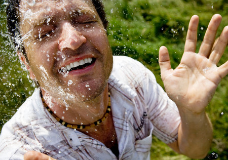 Man splashed with waterの写真素材