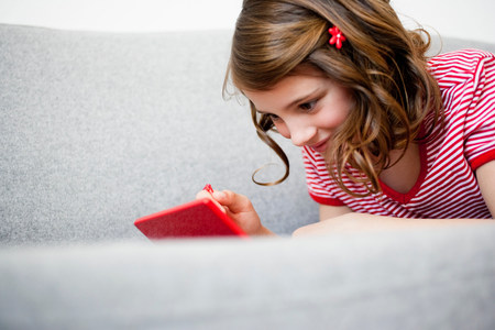 Girl playing video gameの写真素材