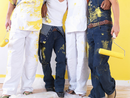 Group taking a break from painting.の写真素材