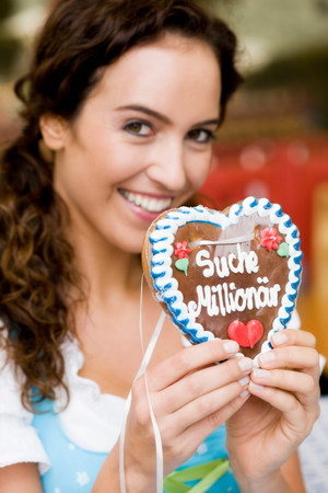 Young Woman With Gingerbread Heartの写真素材