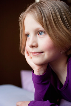 young girl daydreamingの写真素材