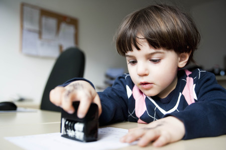 young boy with stampの写真素材