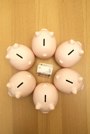 piggy banks guarding moneyの写真素材