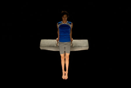 gymnast on pommel horse holding poseの写真素材