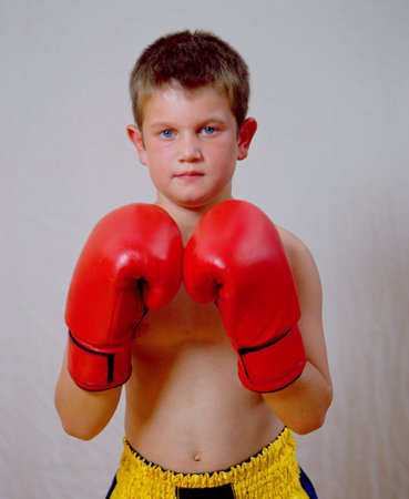 A young boy in boxing outfitの写真素材